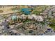 Stunning aerial view showcasing the community clubhouse, pool, golf course and lush landscaping at 15774 W Indianola Dr # Six, Goodyear, AZ 85395