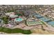 Overhead view showcasing the community pool, tennis courts, lush landscaping, and putting greens at 15774 W Indianola Dr # Six, Goodyear, AZ 85395