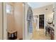 Bright bathroom boasts granite counters, double sinks, and entrance to walk-in closet at 15774 W Indianola Dr # Six, Goodyear, AZ 85395