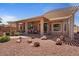 Outdoor living at its finest featuring a covered patio and rock landscaping at 15774 W Indianola Dr # Six, Goodyear, AZ 85395