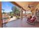 Enjoy the covered patio with ceiling fan, charming landscape and well-manicured backyard at 15774 W Indianola Dr # Six, Goodyear, AZ 85395