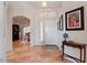 Welcoming foyer with neutral tile flooring, arched doorways, and stylish décor at 15774 W Indianola Dr # Six, Goodyear, AZ 85395