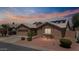 Beautiful single-story home featuring desert landscaping, a garage, and solar panels on the roof at 15774 W Indianola Dr # Six, Goodyear, AZ 85395