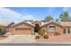Charming single-story home with well-maintained landscaping, neutral tones, and solar panels at 15774 W Indianola Dr # Six, Goodyear, AZ 85395
