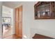 Hallway featuring hardwood floors and access to a well-lit bedroom at 15774 W Indianola Dr # Six, Goodyear, AZ 85395