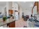 Bright open kitchen featuring granite countertops, and a seamless flow into the dining area at 15774 W Indianola Dr # Six, Goodyear, AZ 85395