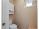 Powder room features a toilet and cabinet for extra storage and accessories at 15774 W Indianola Dr # Six, Goodyear, AZ 85395