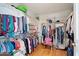 Spacious walk-in closet with custom shelving and rods for ample storage at 15774 W Indianola Dr # Six, Goodyear, AZ 85395