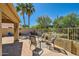 Backyard patio with desert landscaping, seating, stone flooring and a privacy wall at 17323 E Teal Dr, Fountain Hills, AZ 85268