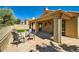Outdoor patio with chairs, desert landscaping, stone flooring, and shade at 17323 E Teal Dr, Fountain Hills, AZ 85268