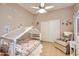 Charming bedroom with whimsical decor, a canopy bed, and a cozy chair, perfect for a imaginative play at 17323 E Teal Dr, Fountain Hills, AZ 85268