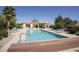 Sparkling community pool with ample deck space, lounge chairs, and shaded cabana areas for residents at 17323 E Teal Dr, Fountain Hills, AZ 85268