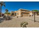 Southwest-style home featuring desert landscaping, including gravel, cacti, and a two-car garage at 17323 E Teal Dr, Fountain Hills, AZ 85268