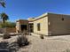 Southwest-style home featuring desert landscaping, including gravel, cacti, and a two-car garage at 17323 E Teal Dr, Fountain Hills, AZ 85268