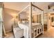 Elegant main bedroom with a four-poster bed, ceiling fan, and ample natural light, creating a serene retreat at 17323 E Teal Dr, Fountain Hills, AZ 85268