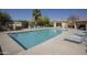 Inviting community pool area surrounded by lounge chairs and lush landscaping at 17323 E Teal Dr, Fountain Hills, AZ 85268