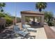 Community poolside cabana features lounge chairs and an outdoor dining table near desert landscaping at 17323 E Teal Dr, Fountain Hills, AZ 85268