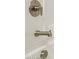 Close-up of modern brushed nickel shower fixture and sleek bathtub at 17755 W Onyx Ave, Waddell, AZ 85355