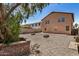 Backyard with rock ground cover, patios, and garden boxes at 18475 N Madison Rd, Maricopa, AZ 85139