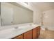 A bathroom features double sinks and a mirror at 18475 N Madison Rd, Maricopa, AZ 85139