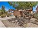 Charming two-story home featuring a two-car garage and low-maintenance desert landscaping at 18475 N Madison Rd, Maricopa, AZ 85139