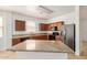 Beautiful kitchen featuring granite countertops, stainless steel refrigerator and wood cabinets at 18475 N Madison Rd, Maricopa, AZ 85139