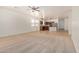 Spacious living room with plush carpeting, neutral walls, ceiling fan, and natural light at 18475 N Madison Rd, Maricopa, AZ 85139