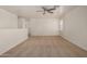 Spacious, neutral loft with ceiling fan perfect for entertaining or relaxing at 18475 N Madison Rd, Maricopa, AZ 85139