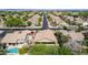 An aerial view showcases the home's well-maintained roof, neighborhood, and proximity to the neighborhood streets at 1926 S Longspur Ln, Gilbert, AZ 85295