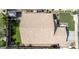 Birds eye view of the roof and backyard featuring artificial turf, manicured landscaping, and paved walkways at 1926 S Longspur Ln, Gilbert, AZ 85295