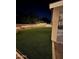 Backyard with an extended patio, a gazebo with lights, and a well manicured artificial turf lawn at 1926 S Longspur Ln, Gilbert, AZ 85295