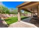 Large covered patio with a lush green lawn and a charming gazebo at 1926 S Longspur Ln, Gilbert, AZ 85295