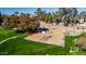 Aerial view of a basketball court surrounded by green space and trees in the community at 1926 S Longspur Ln, Gilbert, AZ 85295