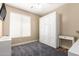 Cozy bedroom with carpet, natural lighting, and a Murphy bed at 1926 S Longspur Ln, Gilbert, AZ 85295