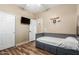 Well-lit bedroom with hardwood floors and a built-in daybed with storage at 1926 S Longspur Ln, Gilbert, AZ 85295