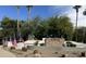 Community entrance with an 'Ashley Heights' sign surrounded by landscaping and American flags at 1926 S Longspur Ln, Gilbert, AZ 85295