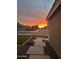 Beautiful sunset view from a landscaped front yard with walkway pavers at 1926 S Longspur Ln, Gilbert, AZ 85295
