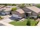 Charming single-story home with a well-manicured lawn, two-car garage, and neutral-toned exterior at 1926 S Longspur Ln, Gilbert, AZ 85295