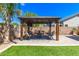 Outdoor gazebo with a seating area and a firepit, perfect for entertaining at 1926 S Longspur Ln, Gilbert, AZ 85295