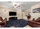 Open living room with tile flooring, comfortable seating, neutral paint, and ceiling fan at 1926 S Longspur Ln, Gilbert, AZ 85295