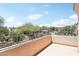 Balcony overlooking a community pool and landscaping at 19475 N Grayhawk Dr # 1128, Scottsdale, AZ 85255