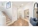 Welcoming entryway featuring staircase, neutral decor, and decorative tile flooring throughout at 19475 N Grayhawk Dr # 1128, Scottsdale, AZ 85255