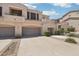 Exterior of a home with three garages at 19475 N Grayhawk Dr # 1128, Scottsdale, AZ 85255