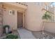 Charming home entrance with desert landscaping and a secure front door at 19475 N Grayhawk Dr # 1128, Scottsdale, AZ 85255