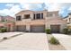 Spacious garage of the tan stucco home with a private balcony at 19475 N Grayhawk Dr # 1128, Scottsdale, AZ 85255