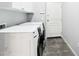 Laundry room with tile floors and white washer and dryer at 19475 N Grayhawk Dr # 1128, Scottsdale, AZ 85255