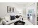 Inviting living room featuring stylish seating, soft lighting, and an open doorway at 19475 N Grayhawk Dr # 1128, Scottsdale, AZ 85255