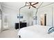 Bright main bedroom featuring a canopy bed, stylish furnishings, and private patio access at 19475 N Grayhawk Dr # 1128, Scottsdale, AZ 85255