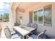 Cozy covered patio with outdoor dining set and views at 19475 N Grayhawk Dr # 1128, Scottsdale, AZ 85255