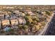 Aerial view of a residential neighborhood, showcasing community landscaping, mature trees, and hardscaping at 21602 N 36Th St, Phoenix, AZ 85050